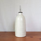 Oil Bottle In Cream