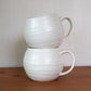 Glossy White Textured Mugs
